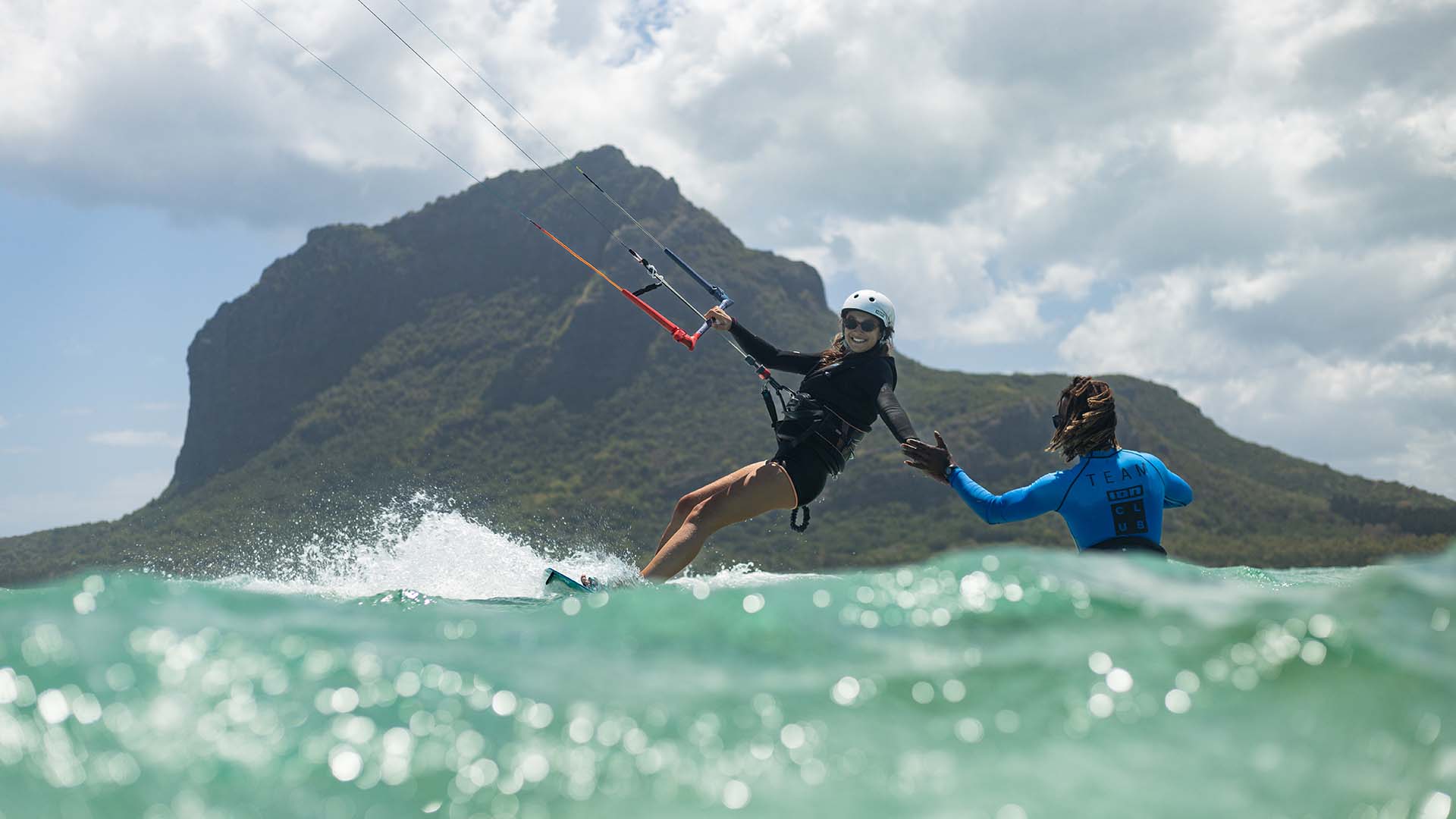 Woman student is learning how to stand up on the surf board